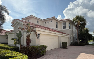 Freshly painted coastal two-story home near the water in Sarasota, Florida with exterior paint built to resist salt air and sun